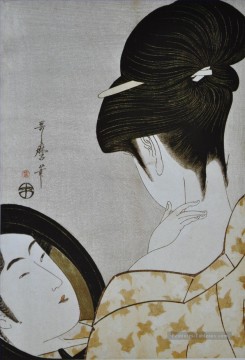 jeune femme appliquant composent 1796 Kitagawa Utamaro japonais Peinture à l'huile